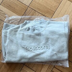 Solidcore Mockneck Sweatshirt. Brand new. Size L
